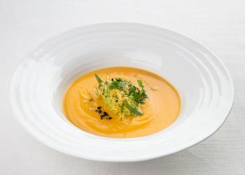 Pumpkin cream soup with almond milk and guacamole