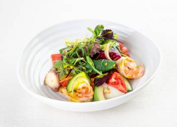 Salad with octopus and shrimp in orange oil