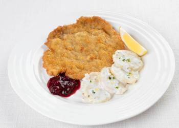 Classic Viennese schnitzel with potato salad and cranberry jam